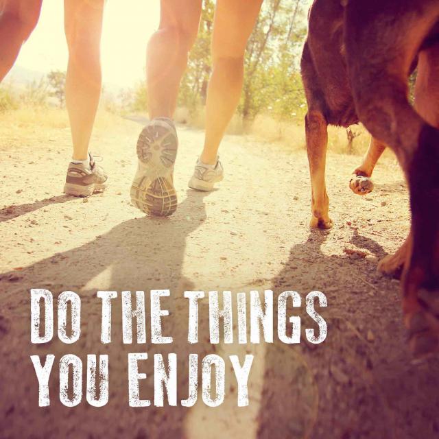 Two people and a dog running on a path with text saying "do the things you enjoy"