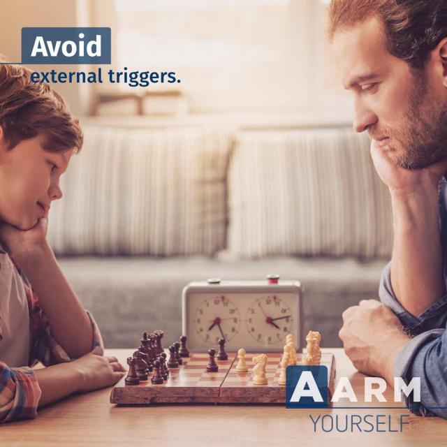 Man and son playing chess with text saying "avoid external triggers" and acronym "AARM yourself"